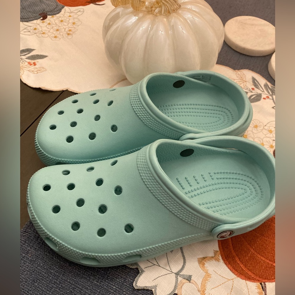 Teal Crocs, Size 10W.